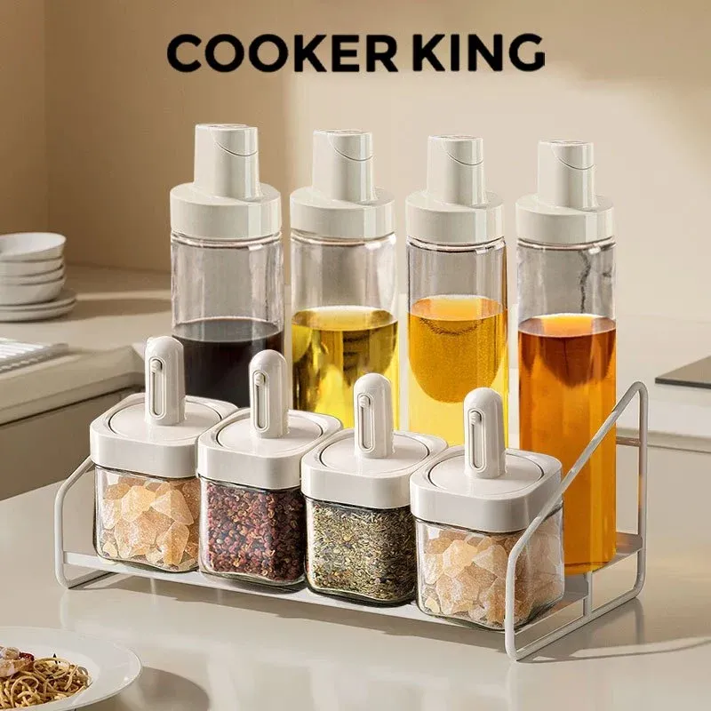 Cooker King 8-piece glass seasoning bottle set with oil dispensers on a rack, front view