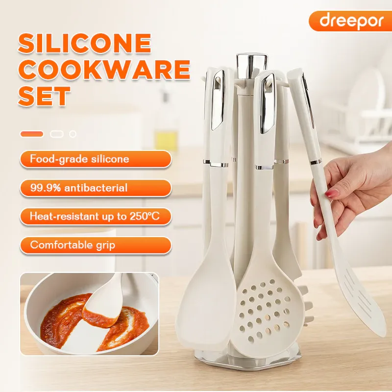 Dreepor seven-piece cream silicone kitchen utensil set hanging on a rotating countertop stand