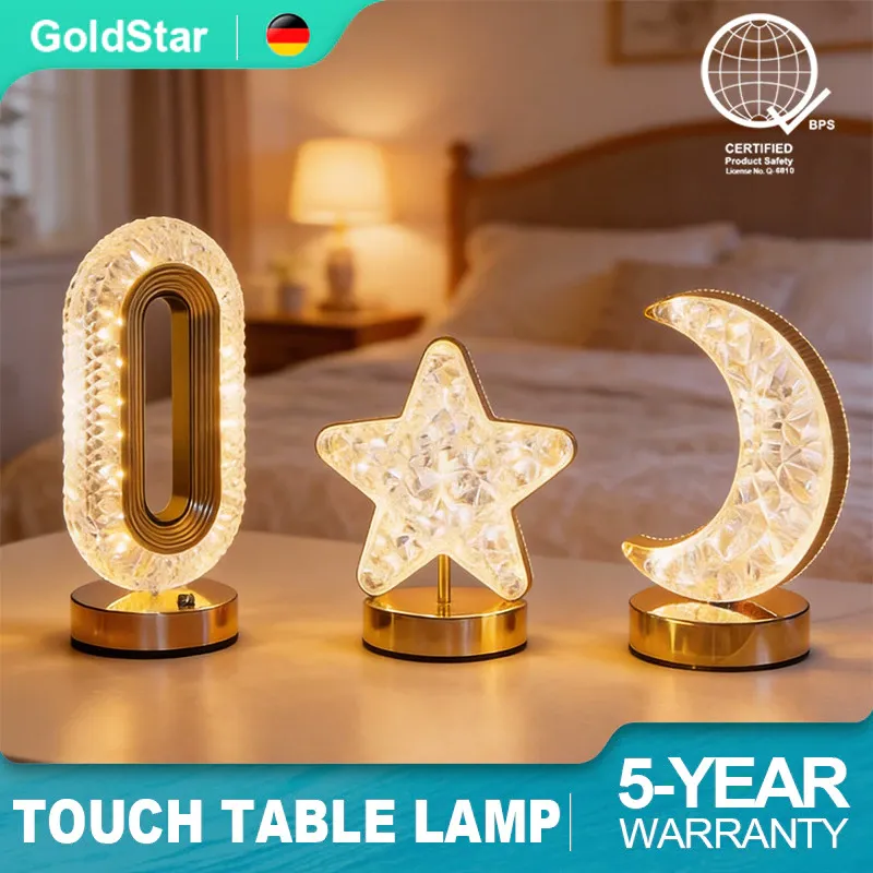 Gold Star crystal-effect bedside table lamp with a faceted shade glowing warm on a nightstand