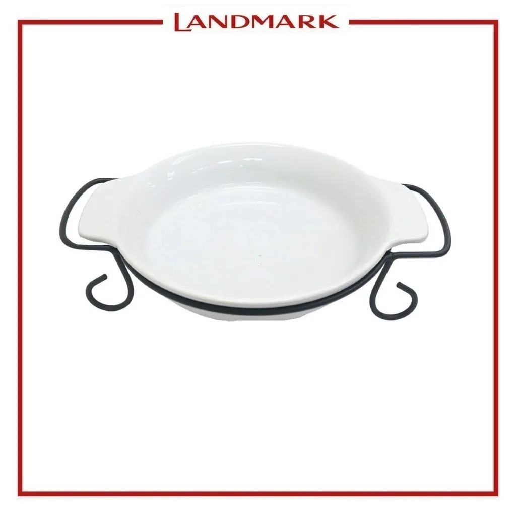 Gracious Dining by Gibson stoneware pie dish sitting in its metal serving rack, angled view