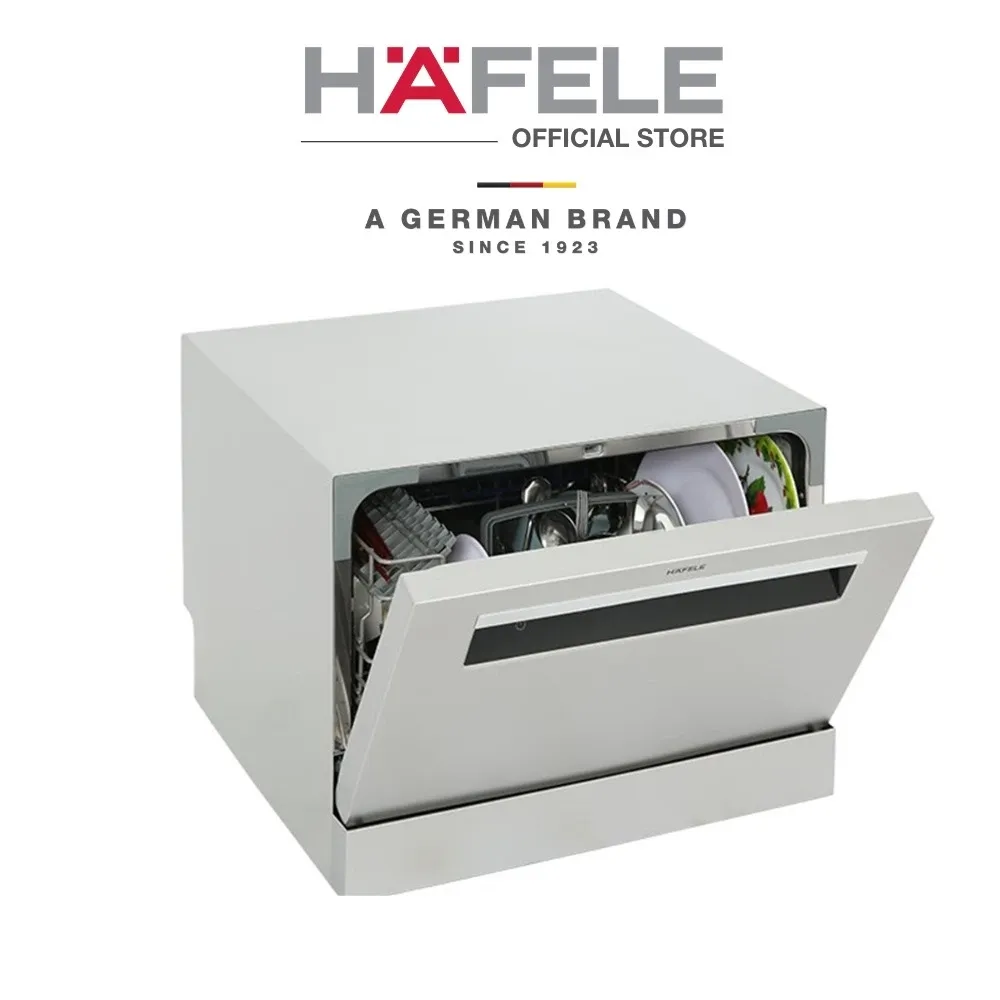 Häfele HDW-T50B white tabletop dishwasher with drop-down door open showing loaded dish racks