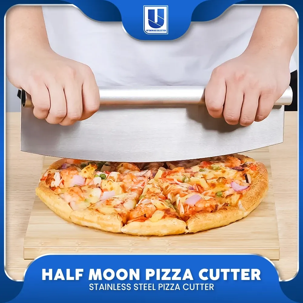 Half moon stainless steel rocker pizza cutter with a one-piece tubular steel handle, cutting a pizza on a wooden board