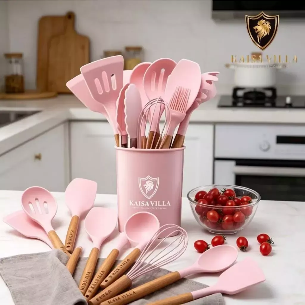 Kaisa Villa pink silicone kitchen utensil set with wooden handles standing in a matching pink holder