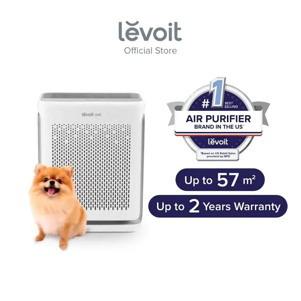Levoit Vital 100S smart air purifier, white boxy unit with slotted front panel, shown beside a small dog