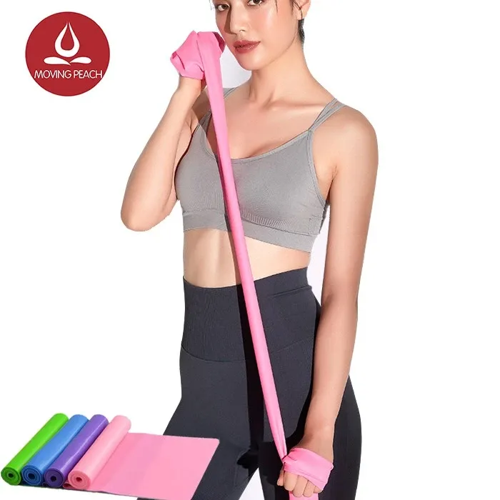 Moving Peach pink flat elastic resistance band being stretched, with green, blue and purple rolls beside it