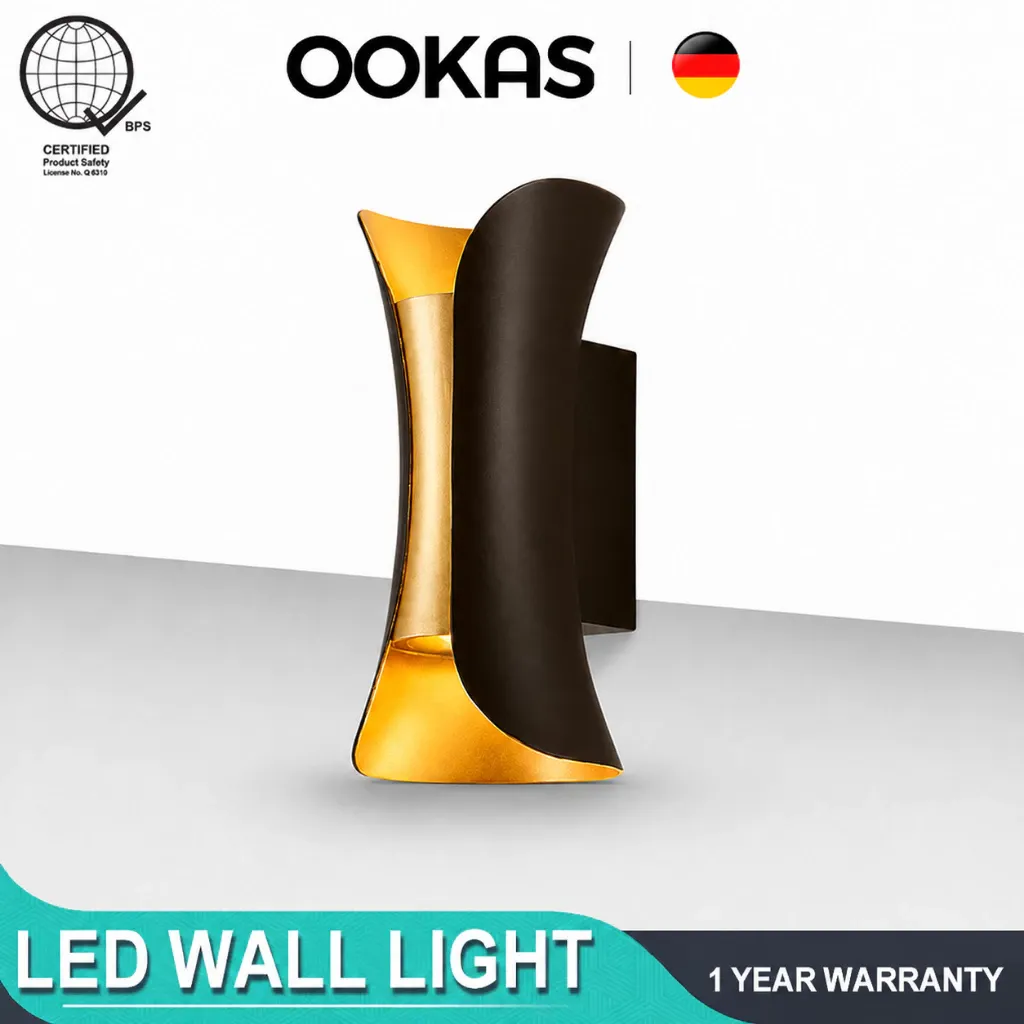 OOKAS curved LED wall light with a matte black outer shell and brushed gold inner reflector, shown against a