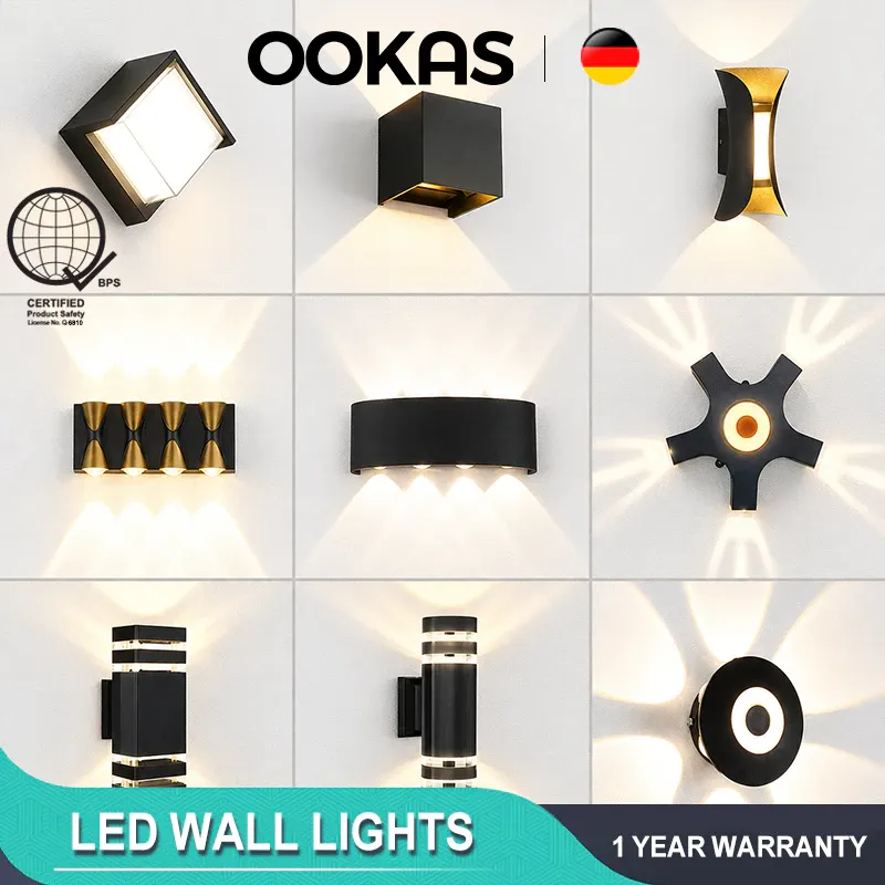 OOKAS modern LED wall lights, nine black up-and-down sconce designs shown lit against a white wall