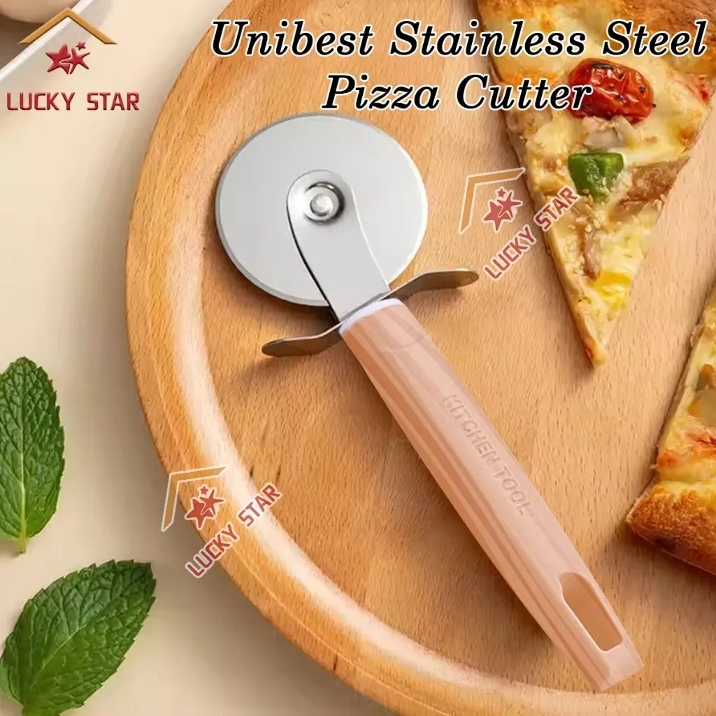 Unibest UBT31 stainless steel pizza cutter wheel with a cream moulded handle, resting on a wooden board