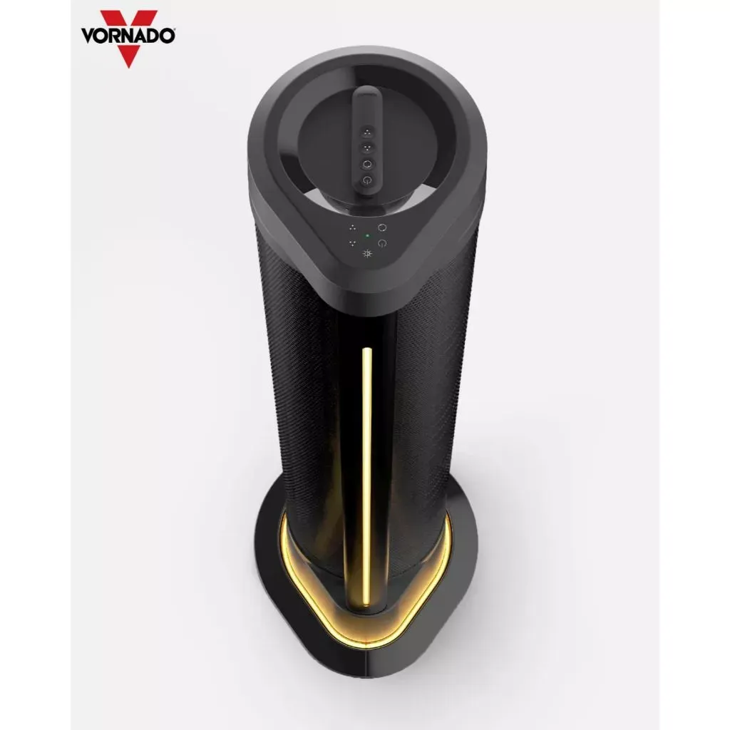 Vornado ARA black oscillating tower fan with amber ambient light glowing at the base, top-down angled view