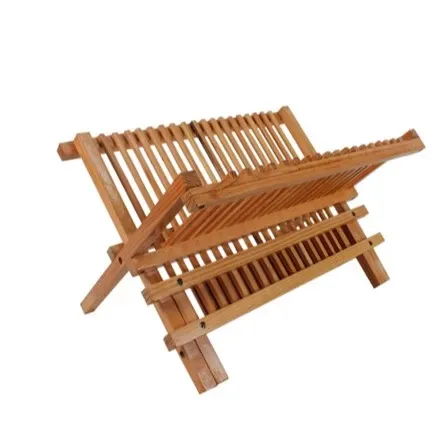 Natural wood X-frame folding dish rack with slatted plate rails on both tiers, angled view on a white background