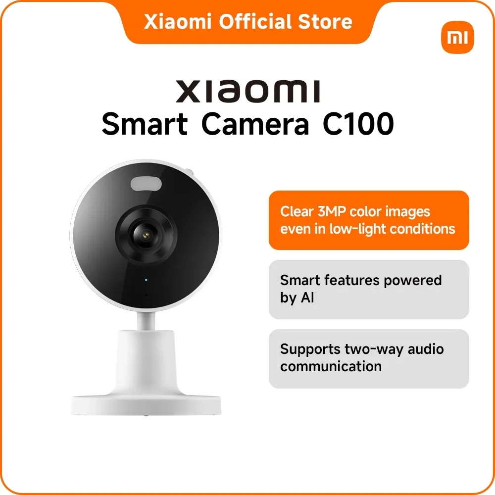 Xiaomi Smart Camera C100, a small round white fixed indoor camera on a short stalk and disc base, front view